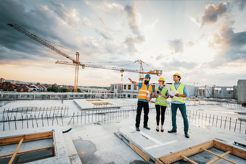 Crane and workers on construction site