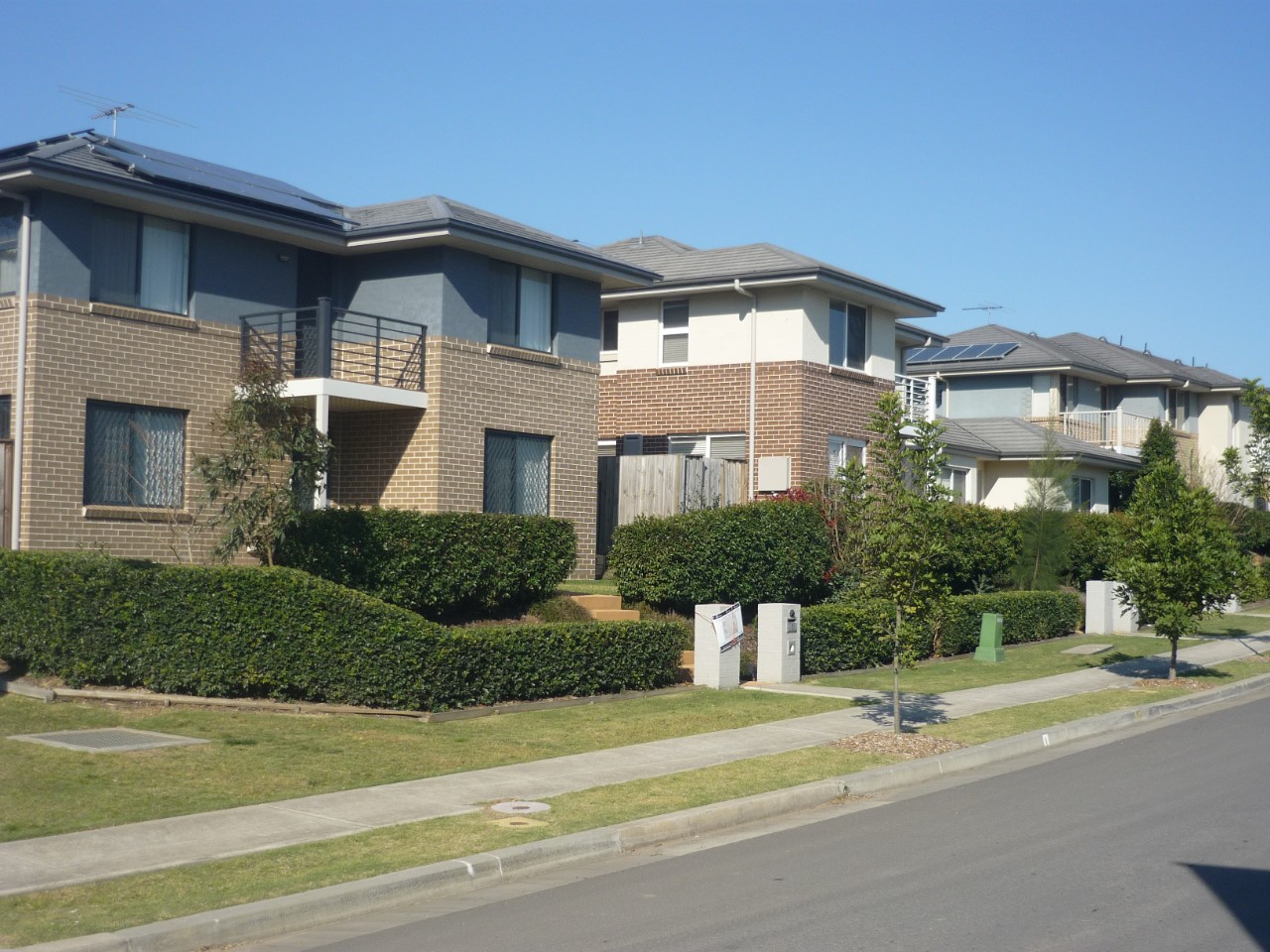 A suburban street with new homes. 