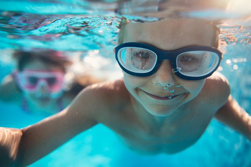 Child swimming underwater 