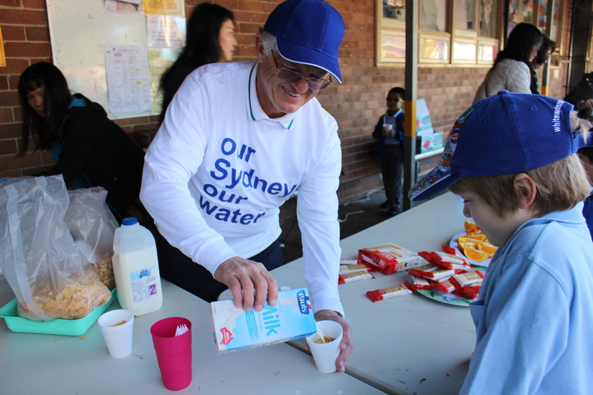 Local community group feeding breakfast to school children