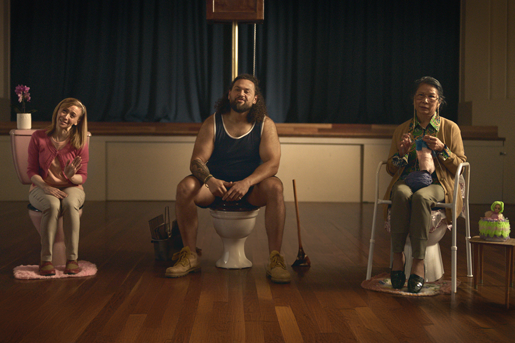 Three characters sitting on toilets from the toilet blockers anonymous advertisement