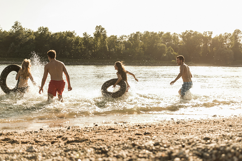 Family in water with rubber rings