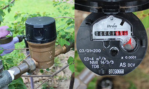 Close-up of an Itron mechanical meter, open and closed, displaying the reading.