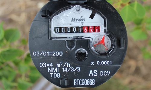 Dial on an Itron brand water meter