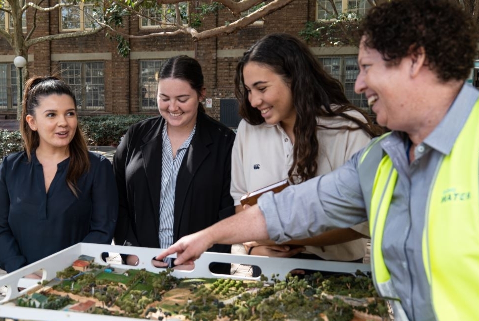 Students looking at an urban water model