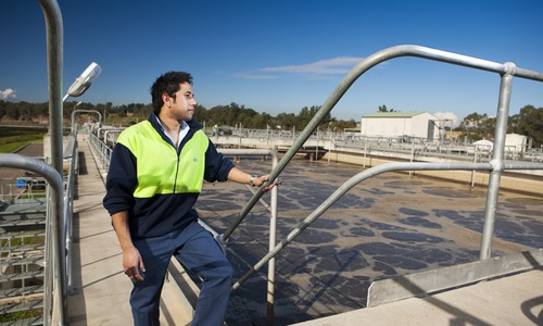 Julian Vivekanandan in front of the biological reactor at Penrtih Water Recycling Plant