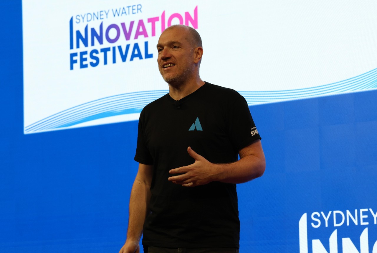 Dom Price speaking at an Inspire and Ignite event at SWIF25