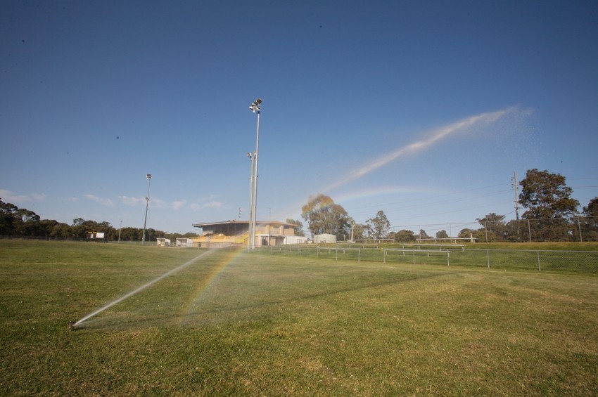 Sprinkler on a sports field.