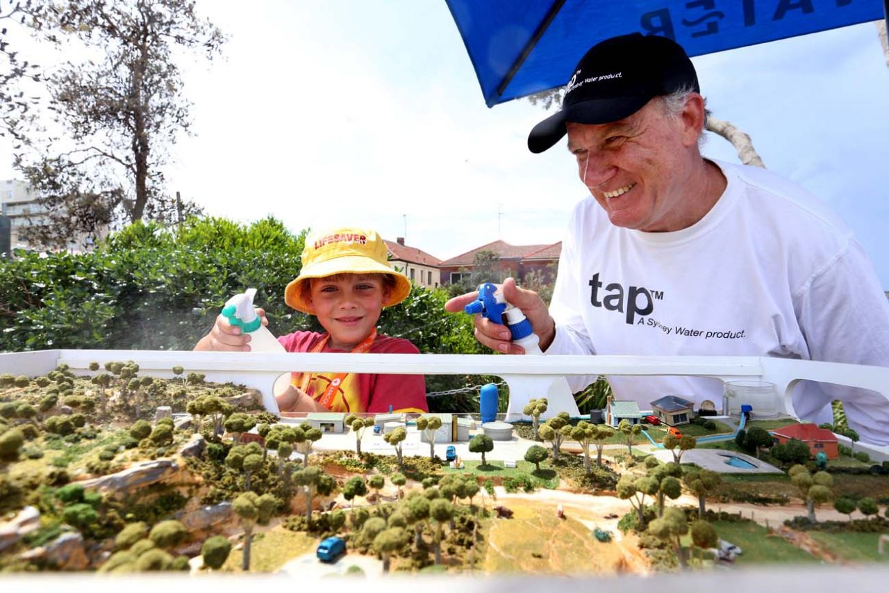 Students looking at an urban water model