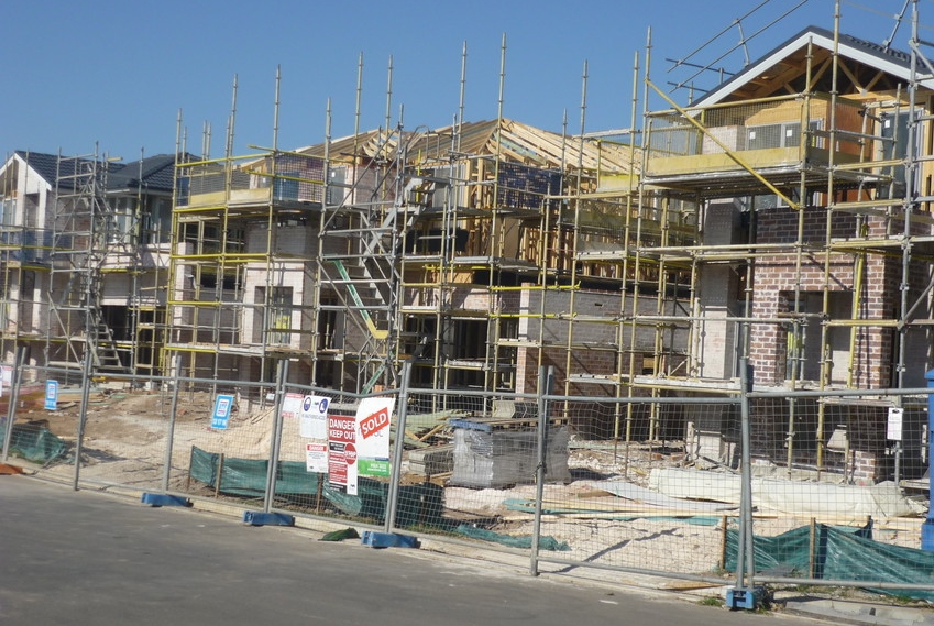 New housing being built, surrounded by scaffolding