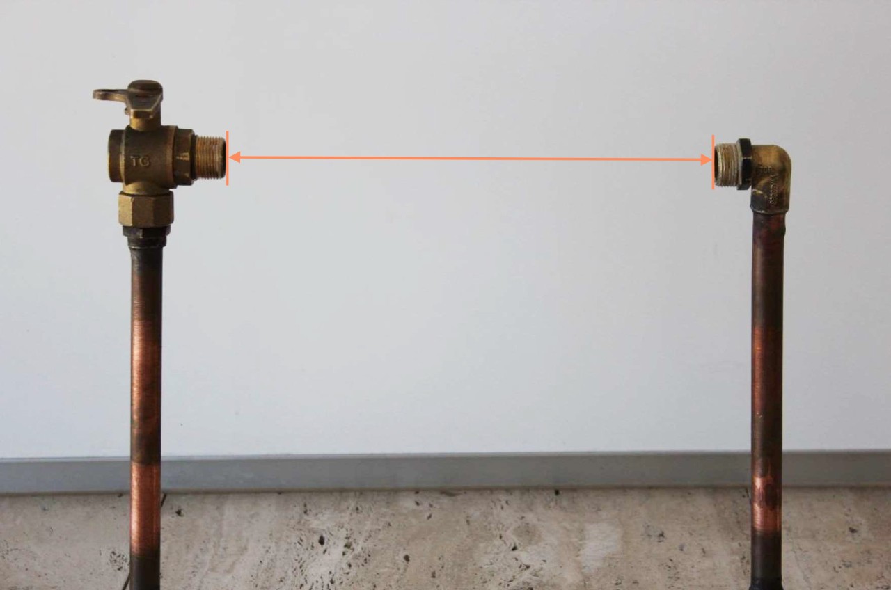 Orange coloured arrow showing the distance you need to measure between threads.