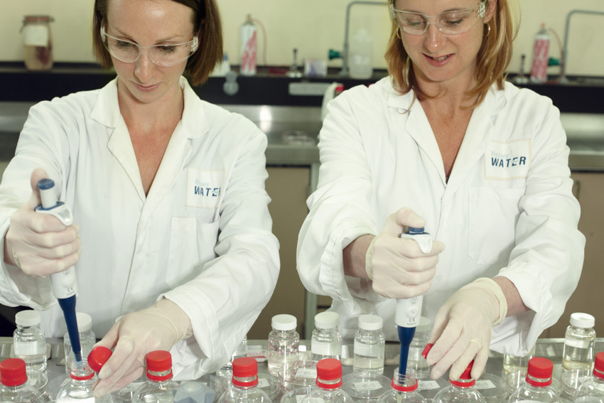 Two scientists testing treated drinking water in our West Ryde laboratory