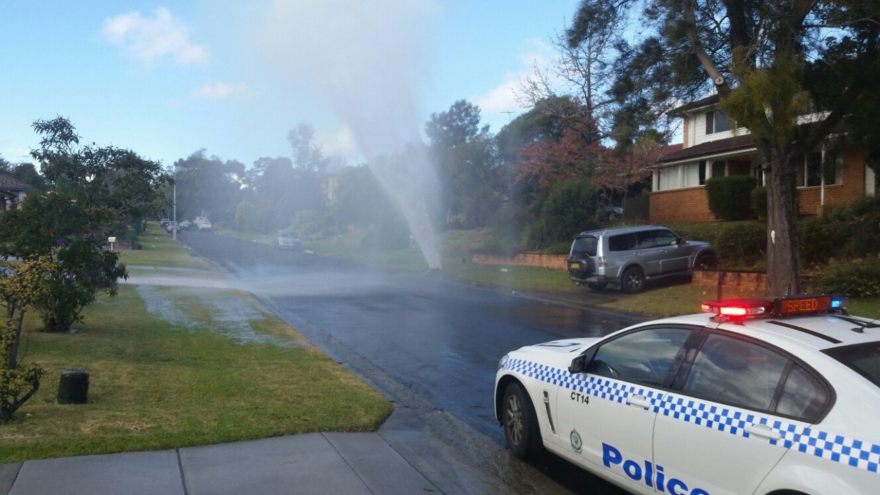 Water spraying in the air from butst pipe
