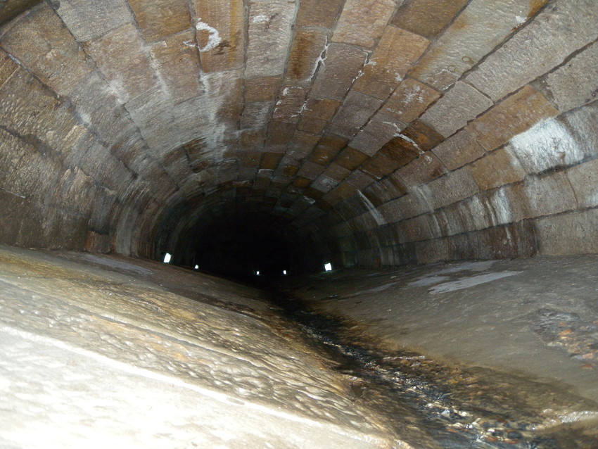 Concrete tunnel with curved brick roof