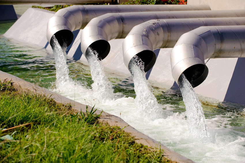 Water being pumped out of pipes, towards the end stages of treatment before it's stored. 