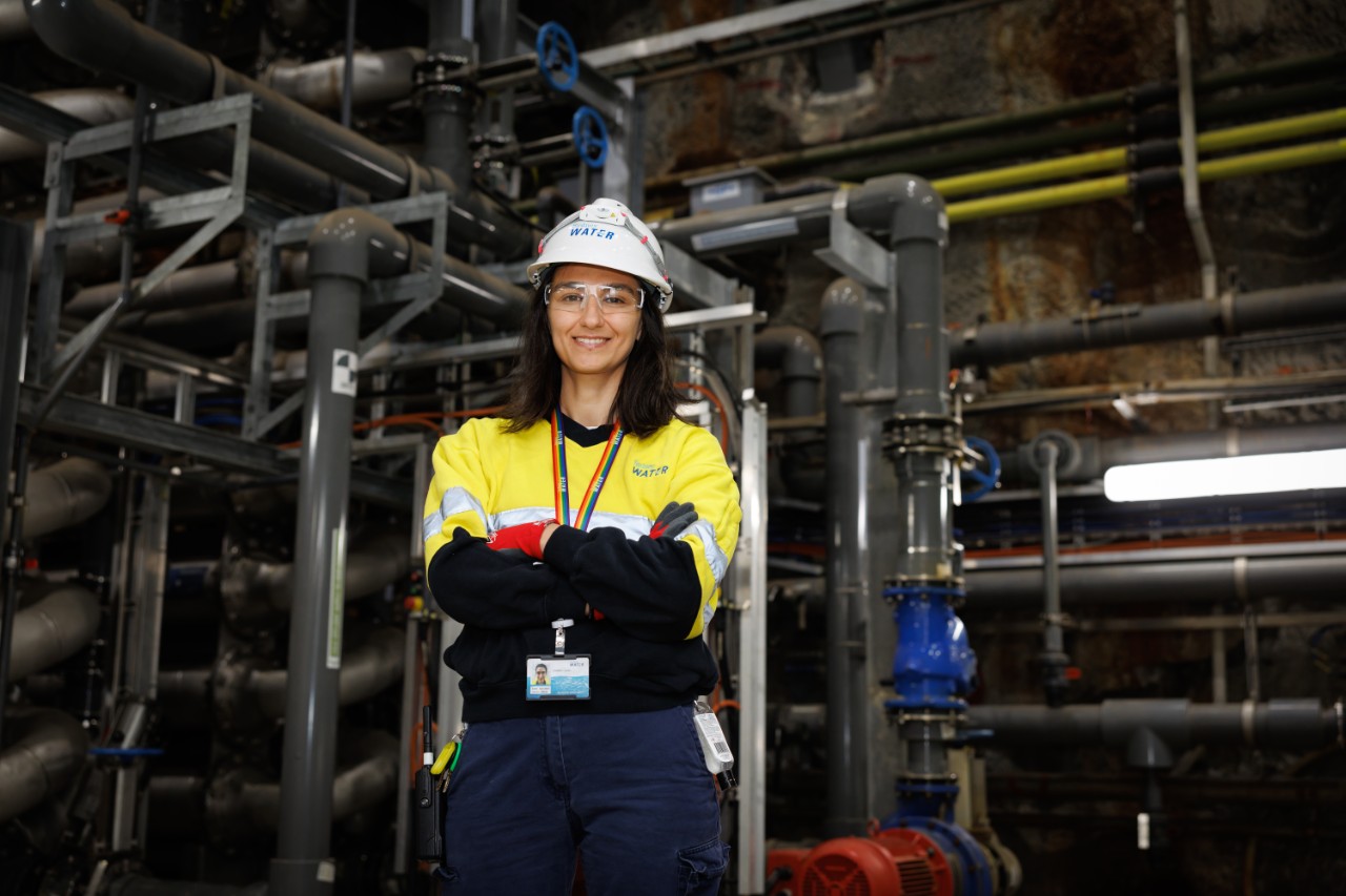 Female staff member surrounded by pipes at our Bondi Water Resource Recovery Facility