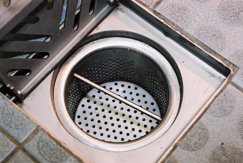 In-floor bucket trap