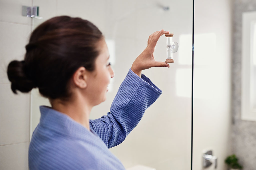 Shower timer being used to take shorter showers. 